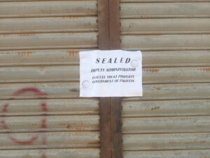 Evacuee trust properties in Karachi amid a dispute between federal and Sindh authorities.