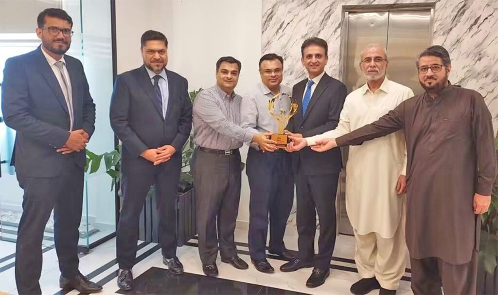Meezan Bank leadership with SBC Group chairman and vice chairman during a Karachi meeting.