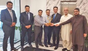 Meezan Bank leadership with SBC Group chairman and vice chairman during a Karachi meeting.
