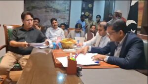 Commissioner Karachi Syed Hassan Naqvi reviews development projects with municipal officials in Karachi.