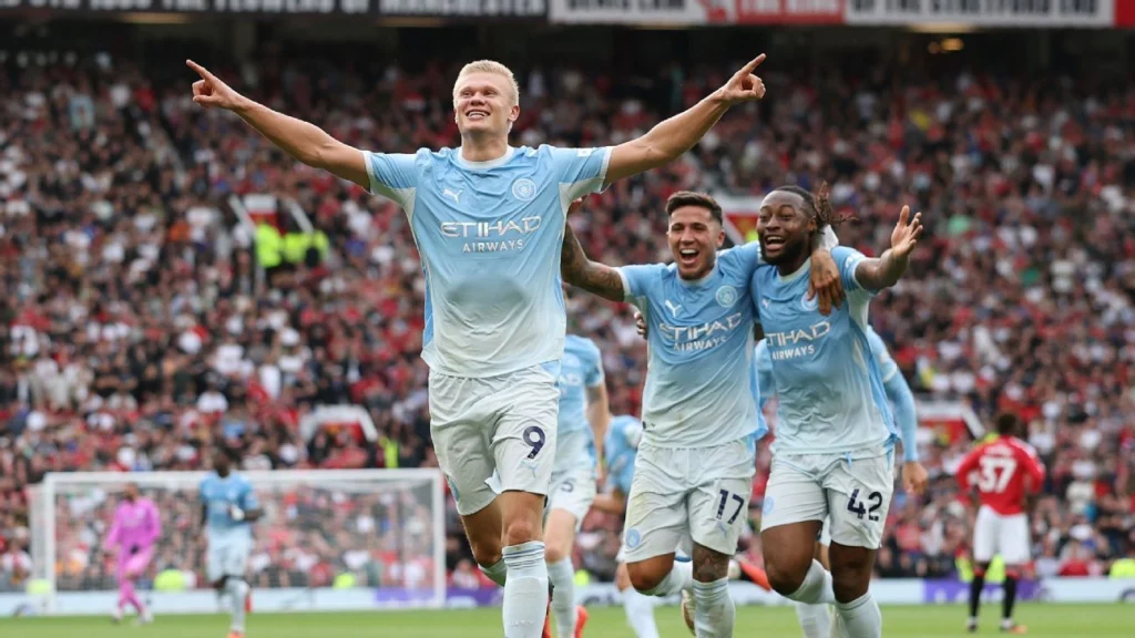 Erling Haaland scores for Manchester City during the Manchester derby against Manchester United
