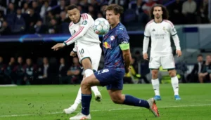Real Madrid players celebrate a 4-1 win over RB Leipzig in the Champions League.
