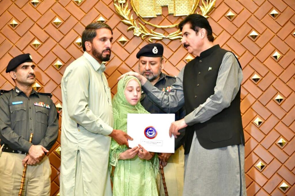 KP Governor Faisal Karim Kundi distributes plot allotment letters to families of 54 police martyrs at Governor House Peshawar