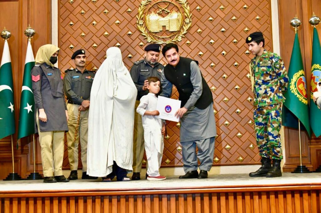 KP Governor Faisal Karim Kundi distributes plot allotment letters to families of 54 police martyrs at Governor House Peshawar