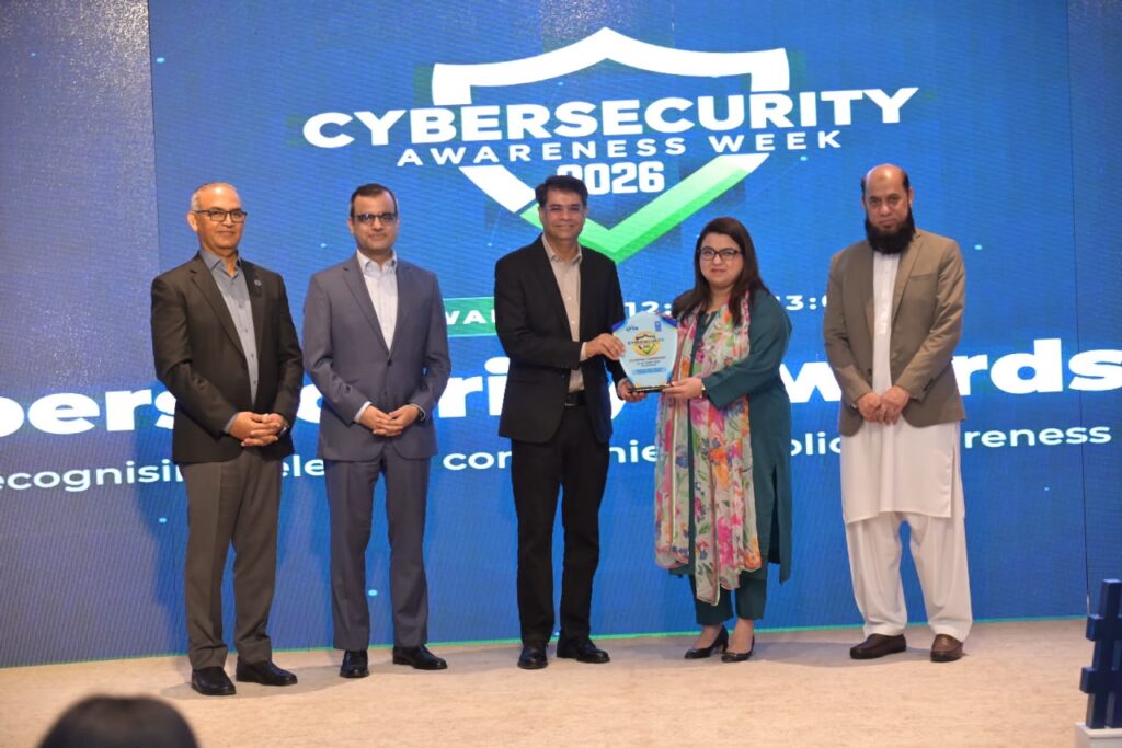 Telenor Pakistan executives Awais Vohra and Shan Haq receive the Cybersecurity Excellence award at the PTA Telecom Cyber Security Awards 2026.