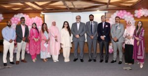 1. National Bank of Pakistan employees participate in a Pinktober 2026 breast cancer awareness session.